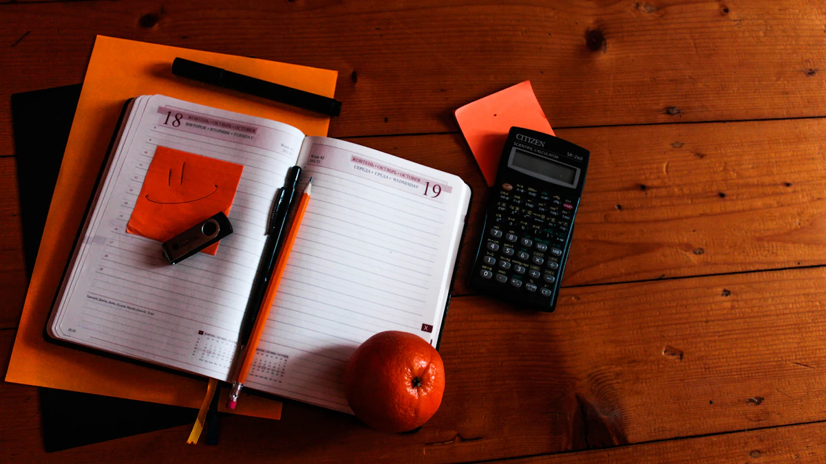 Calculator, planner and notebook laid out for a budgeting session