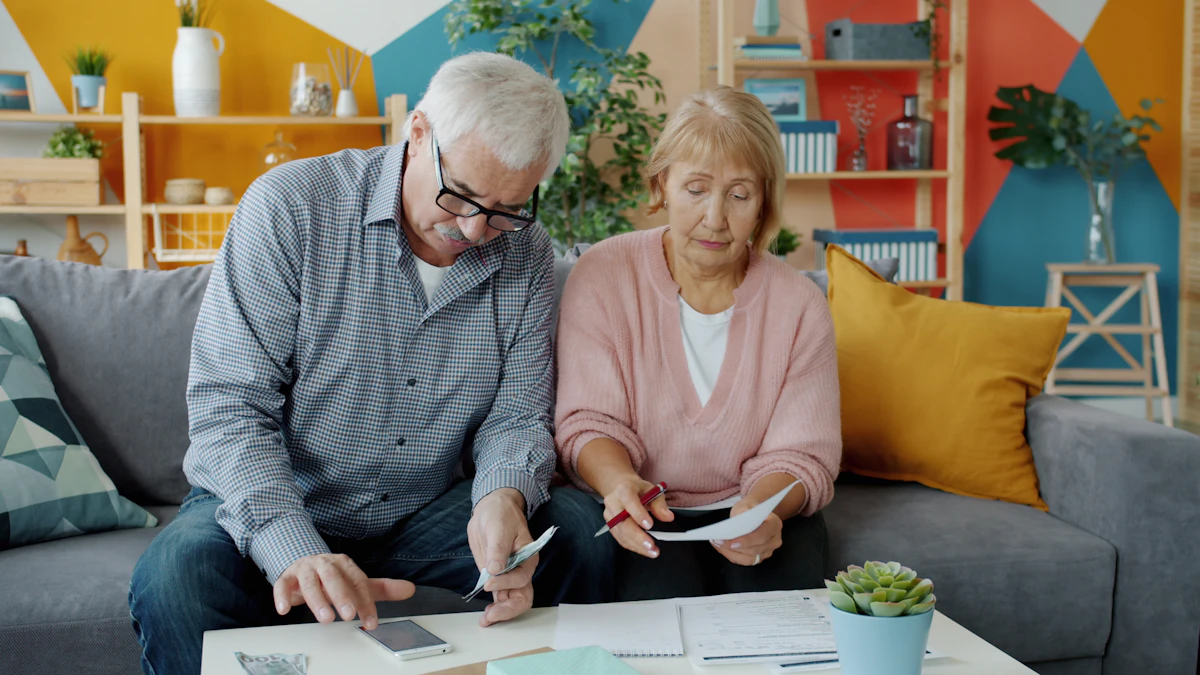 Senior couple reviewing their financial papers together at home