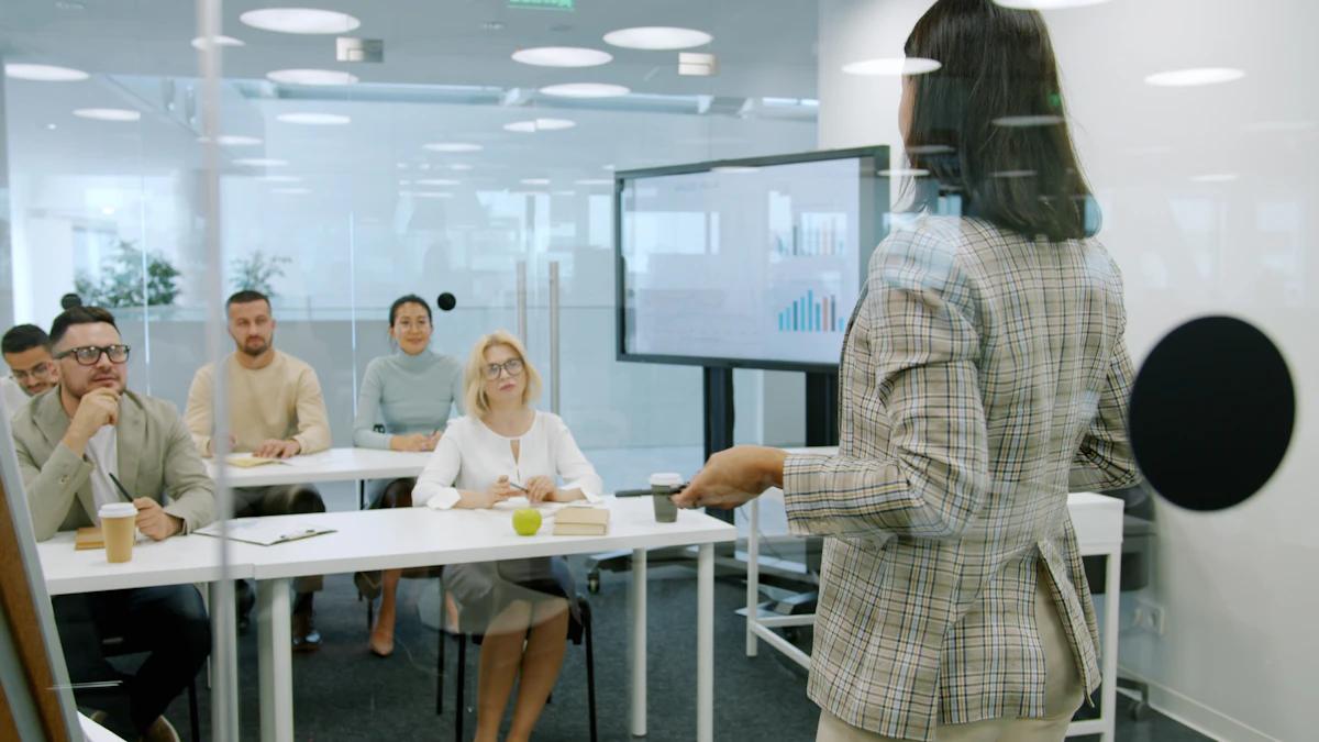 Woman leading a workplace awareness training session for colleagues