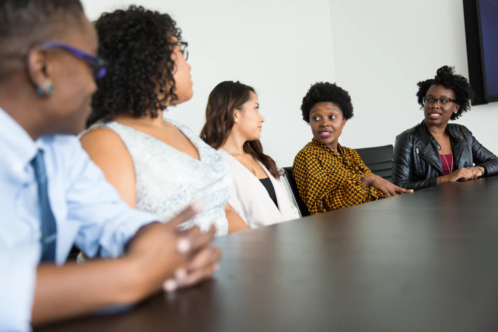 Diverse group of colleagues in a warm, respectful discussion